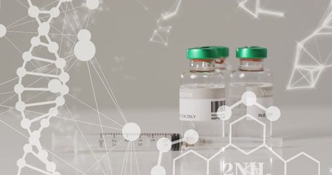Vaccine vials and syringe amidst dna and molecular graphics