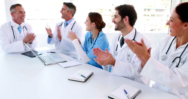 Medical team talking during a meeting in the board room at the hospital
