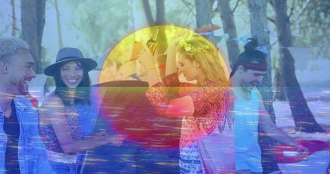 Diverse friends laughing, singing in forest picnic with guitar, floral crown, sun overlay