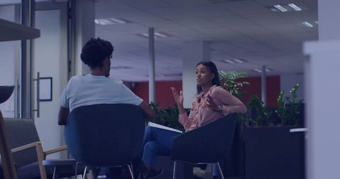 Explaining python evolution and code examples during collaborative tech meeting in office