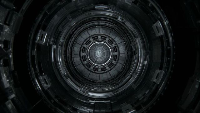 Futuristic radial reactor interior with concentric metal rings and central core port