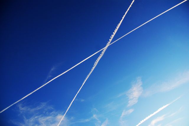 Ideal for use in aviation-related materials, backgrounds for presentations, environmental studies discussing air traffic effects, travel brochures, or weather and atmospheric visuals.