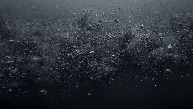 Swirling Sediment and Bubbles in Murky Water Abstract Texture