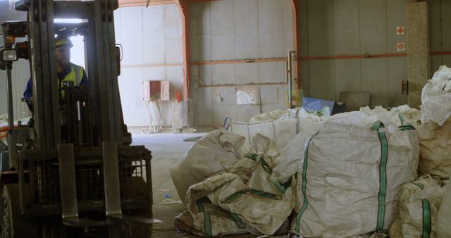 Forklift Operator Moving Large Bags in Warehouse Environment - Download Free Stock Images Pikwizard.com