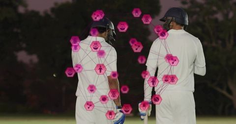 Twilight cricketers wearing white kits and helmets with magenta augmented reality overlay