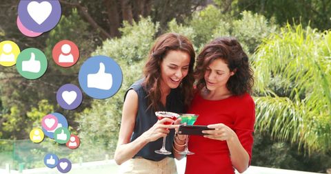 Happy Women Connecting through Social Media on Smartphone
