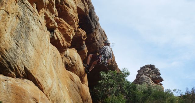 Climber Ascending Rocky Cliff Face Outdoors - Download Free Stock Images Pikwizard.com