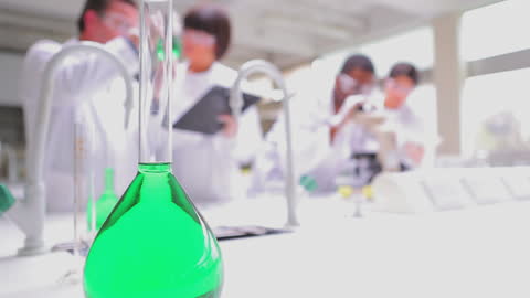Chemists Conducting Experiments in Modern Laboratory