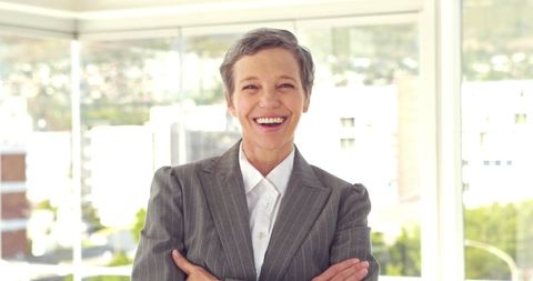 Confident Businesswoman in Bright Corporate Office Environment - Download Free Stock Images Pikwizard.com