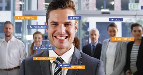 Business Professional in Lobby Surrounded by Social Media Notifications