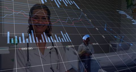 Female Doctor Analyzing Digital Medical Charts in Hospital Room