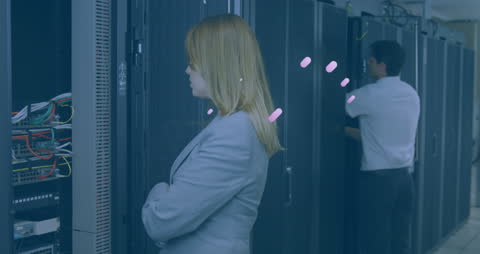 Diverse Professionals Working in Modern Data Server Room