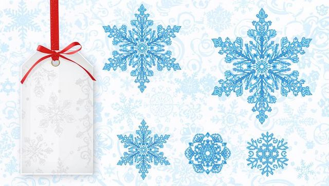 White gift tag with red ribbon and ornamental blue snowflakes holiday background