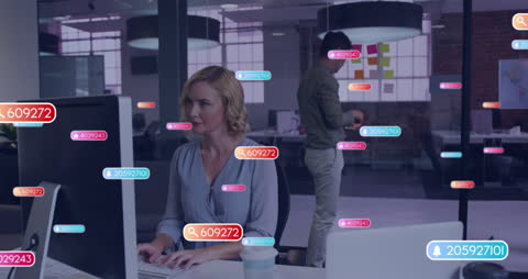 Young Professionals Engaged in Dynamic Modern Office Technology