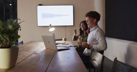 Energetic team meeting with excited diverse colleagues