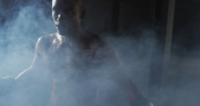 Determined Shirtless Boxer Amidst Smoke in Dark Gym - Download Free Stock Images Pikwizard.com