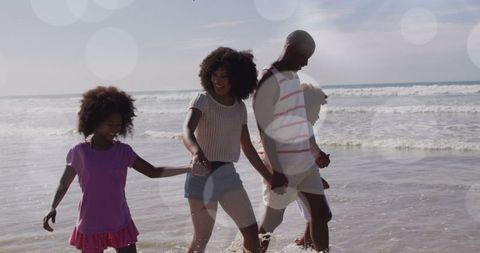 Happy Family Enjoying Beach Walk in Sun