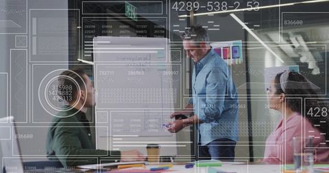 Colleagues in Meeting with Data Visualization Graphics