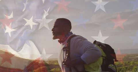 Patriotic Spirit: African American Man Hiking Among Mountains