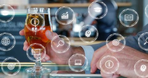 Holding Beer Glass and Tapping Smartphone with Holographic Business Icons and Analytics