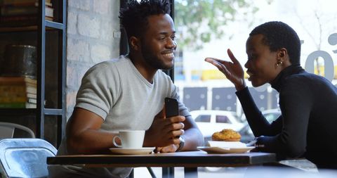 Friendly Conversation at a Cafe with African American Friends - Download Free Stock Images Pikwizard.com