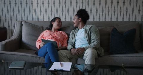 Couple Enjoying Leisure Time with Tablet at Home