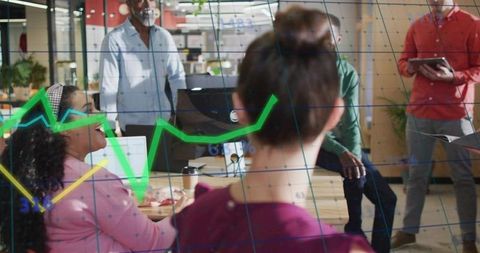 Diverse team presenting data with animated charts in modern office collaboration meeting