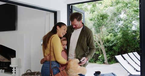 Blended Family Embracing After Homecoming from Vacation