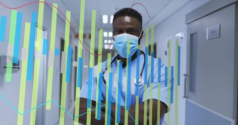 Confident Medical Professional Analyzing Data in Hospital Hallway