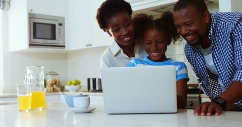 Happy African American Family Watching Laptop in Kitchen - Download Free Stock Images Pikwizard.com