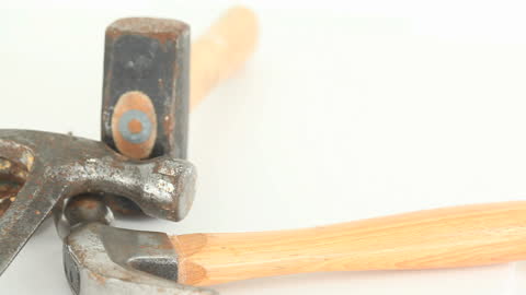 Various Types of Hammers Displayed Against White Background