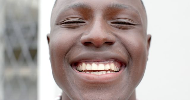 Close-Up of Smiling African-American Man Showing Teeth - Download Free Stock Images Pikwizard.com