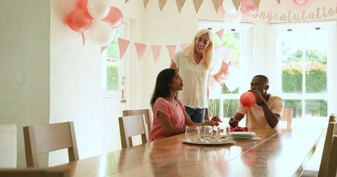 Friends Preparing Decoration and Setup for Home Party Celebration