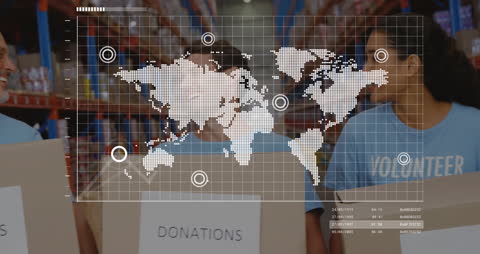 Diverse Volunteers with Donation Boxes in Warehouse with Data Overlay