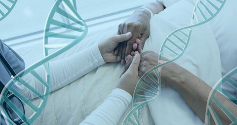 Patient and caregiver holding hands with dna model overlay