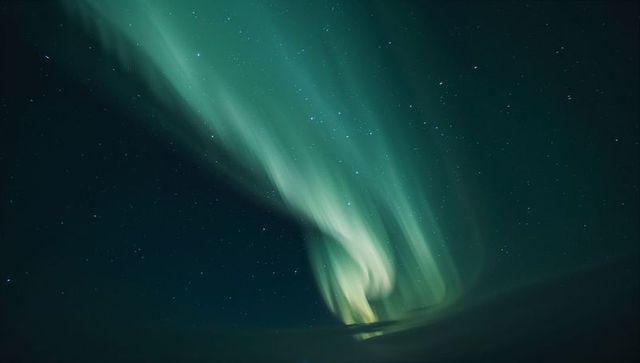 Mystical Northern Lights Swirling in Night Sky