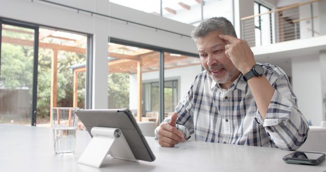 Senior Man Having Video Call on Tablet in Modern Living Room - Download Free Stock Images Pikwizard.com