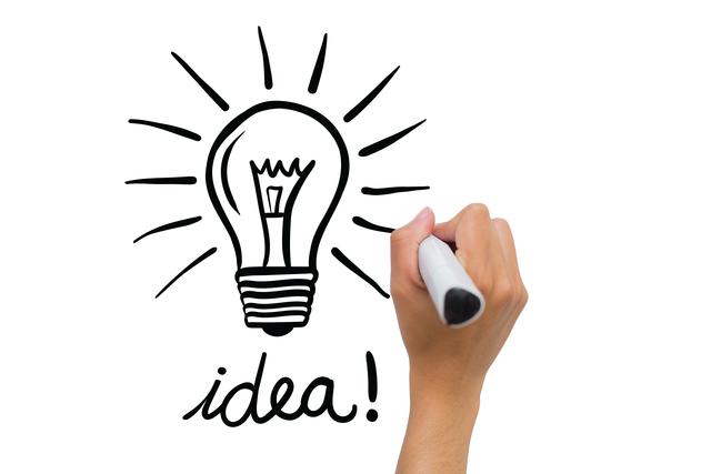 Hand drawing light bulb symbolizing idea and creativity on whiteboard. Great for business presentations, innovation workshops, creative brainstorming sessions, and educational materials highlighting the concept of generating ideas and finding solutions.