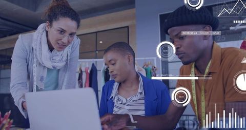 Three designers collaborating over laptop in boutique with digital analytics overlay