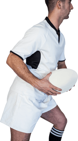 Rugby player holding ball preparing for play transparent