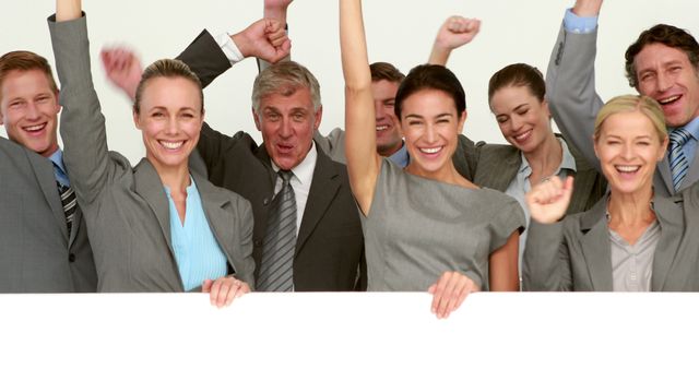 A diverse group of businessmen and businesswomen celebrate a success, with copy space - Download Free Stock Photos Pikwizard.com