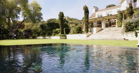 Luxury Home with Elegant Garden and Serene Pool - Download Free Stock Images Pikwizard.com