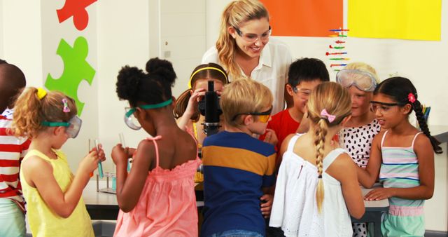 Children Engaging in Science Experiment with Teacher in Classroom - Download Free Stock Images Pikwizard.com