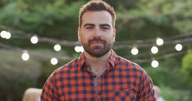 Bearded Man in Plaid Shirt Outdoors with String Lights - Download Free Stock Images Pikwizard.com