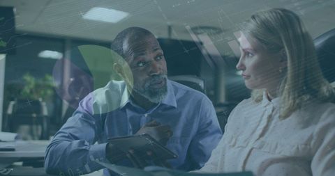 Diverse colleagues discussing business strategy with data