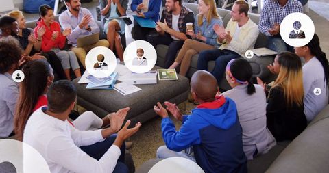 Diverse team celebrating success with applause in office