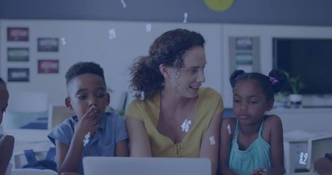 Diverse Teacher and Kids Learning With Technology Together