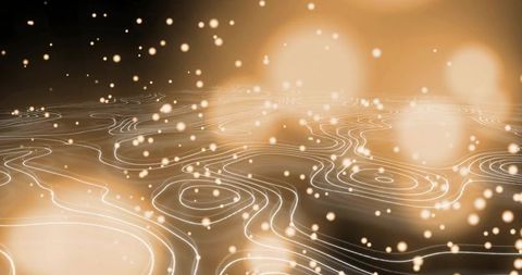 Glowing contour lines flowing over luminous golden abstract topography sparkling particles