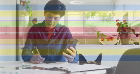 Person Working from Home with Rainbow Pride Overlay and Pet Dog