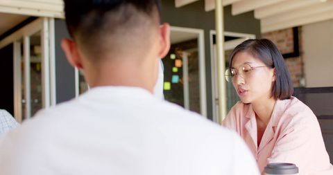 Diverse team engaging in creative office discussion